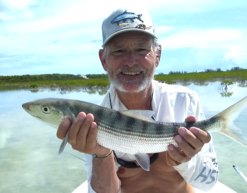 Happy angler with a bonefish